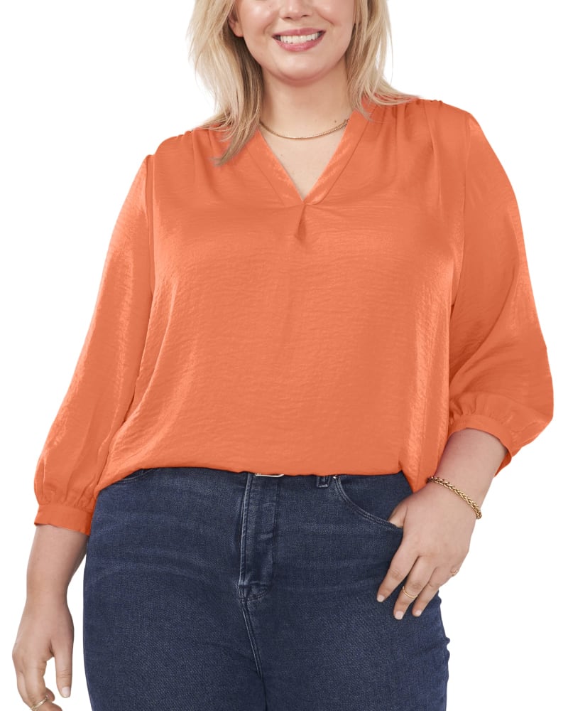 Front of a model wearing a size 1X Everley V-Neck Blouse in SUNSET CORL by Vince Camuto. | dia_product_style_image_id:261726